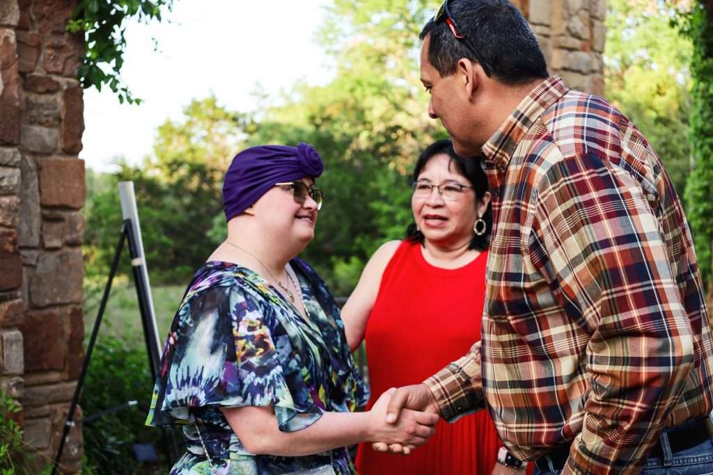 people shaking hands at event