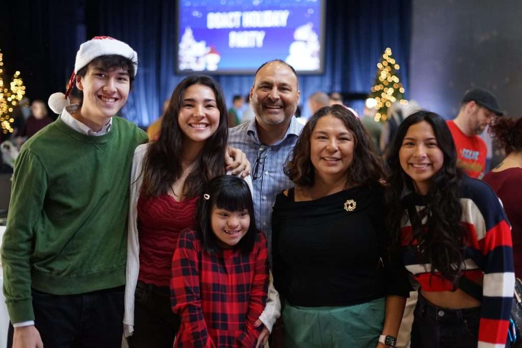 Family posing for photo at 2024 DSACT Holiday Party